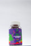 Jar of Sea Moss & Elderberry Gummies with a colorful label on a white background