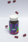 Bottle of Sea Moss & Blackberry Gummies with scattered gummies on a light gray background